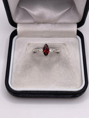 Silver garnet and zircon ring
